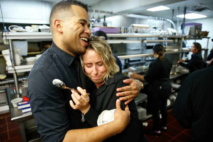 Jordan Roberts consoles Brandi Kenney on the last day of business at the Palm Restaurant in...