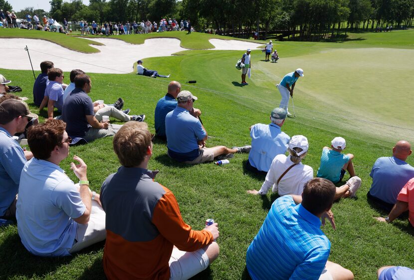 Fans watched as eventual winner K.H. Lee hit a putt on the 12th hole during Round 1 of the...