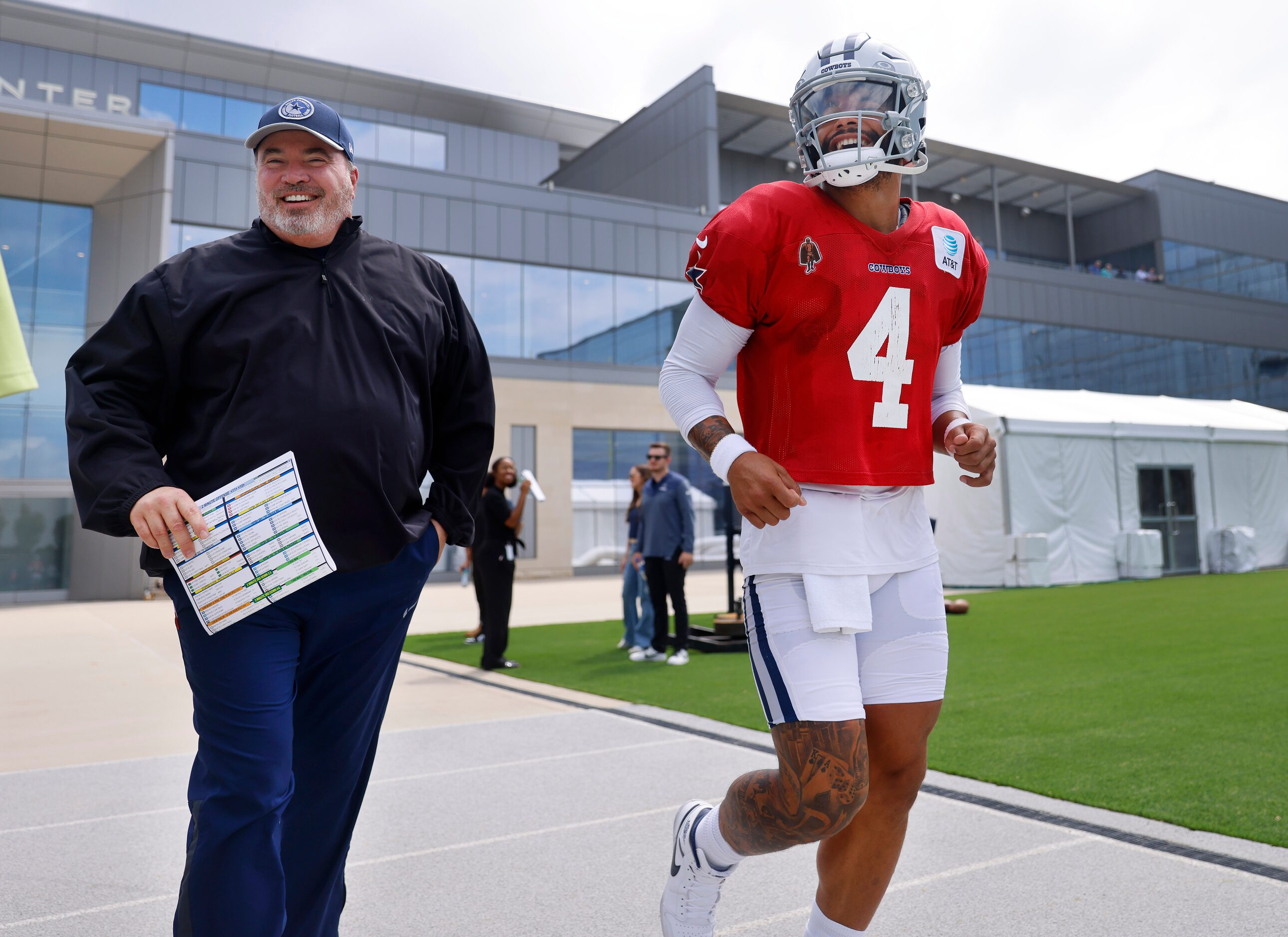 Dallas Cowboys head coach Mike McCarthy  and quarterback Dak Prescott (4) head to the field...