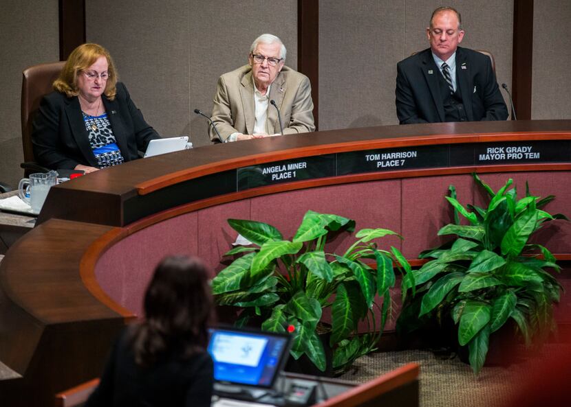"I intend to stay the course," Plano City Council member Tom Harrison (center) said at...