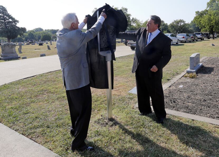 Wylie Mayor Eric Hogue (right) and Rev. Al Draper unveil a Texas historical marker at the...