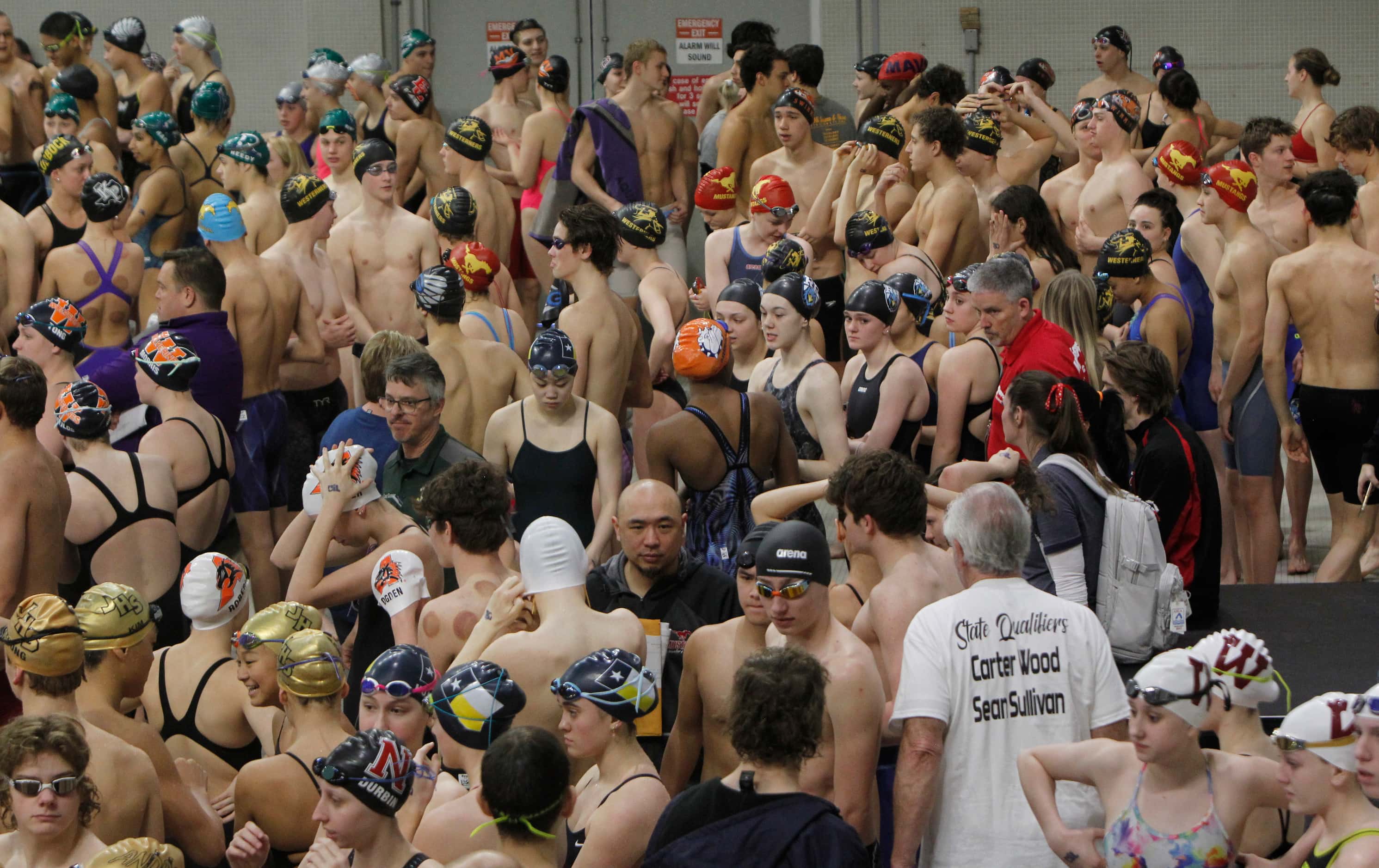 Boy and girl swimmers assemble before the start of competition. The first day of the UIL...