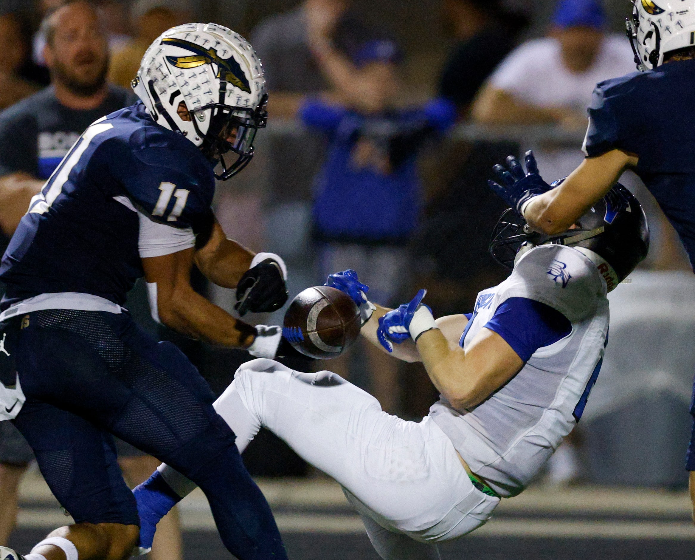 Keller defensive back Amarion Henry (11) strips the ball from Trophy Club Byron Nelson...