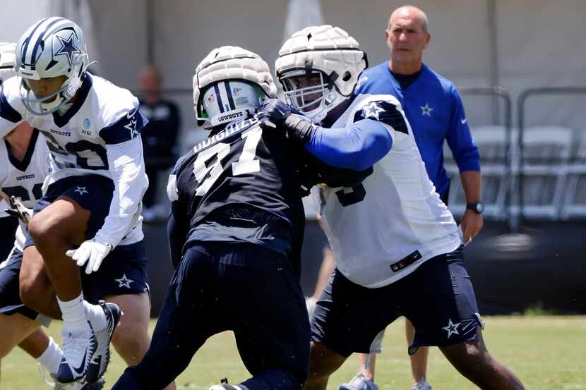 Dallas Cowboys rookie offensive tackle Tyler Smith (73) squares off against defensive tackle...