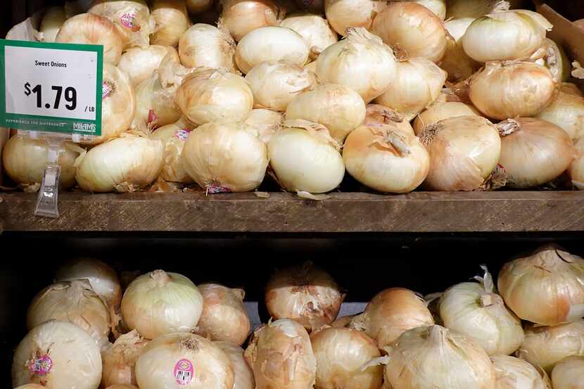 MIAMI, FLORIDA - OCTOBER 22: Onions on display in a supermarket on October 22, 2021 in...