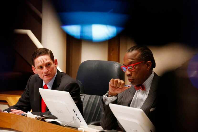
Dallas County Judge Clay Jenkins (left) listens to District 4 Commissioner Dr. Elba Garcia...