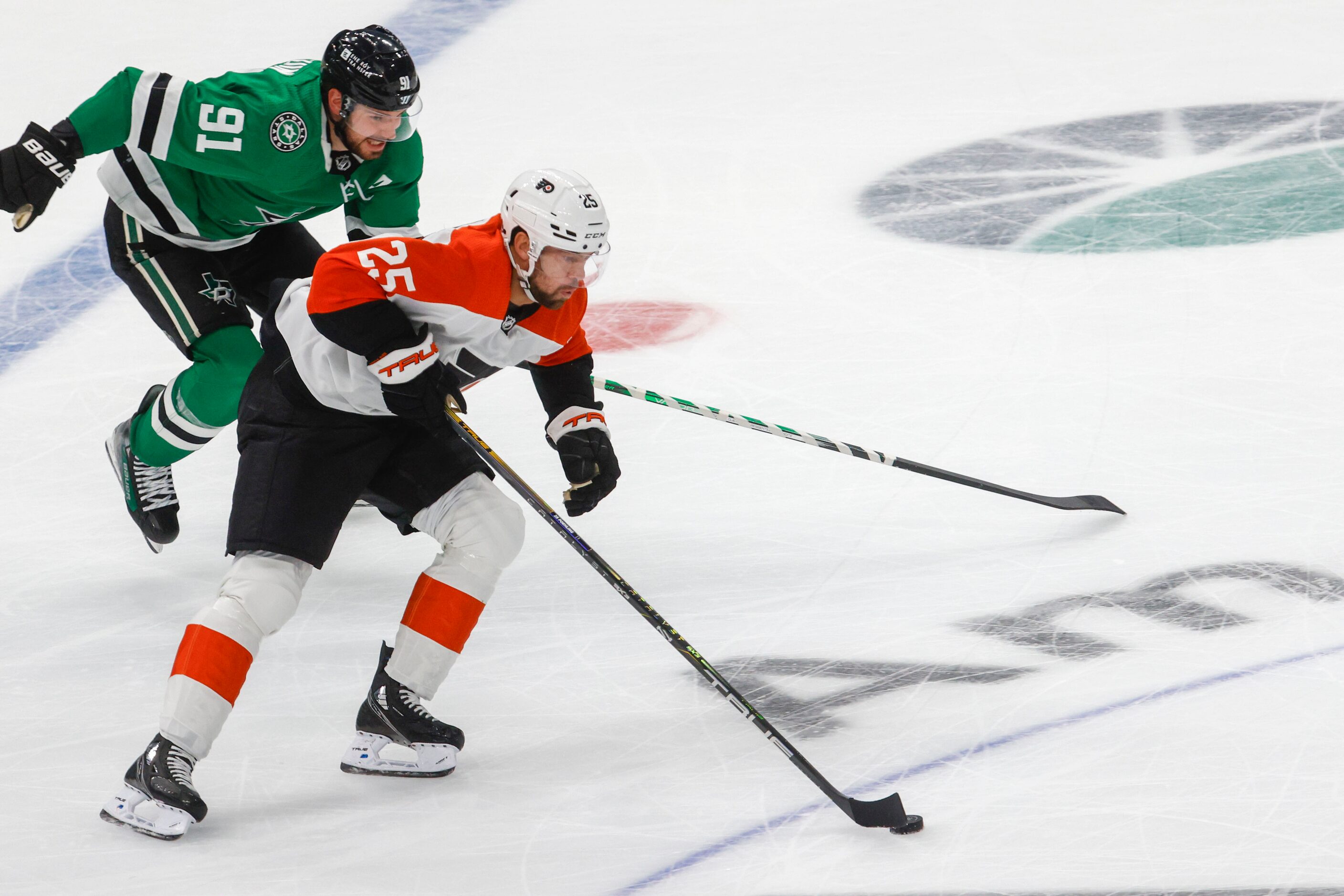 Dallas Stars center Tyler Seguin (back) battles against Philadelphia Flyers center Ryan...