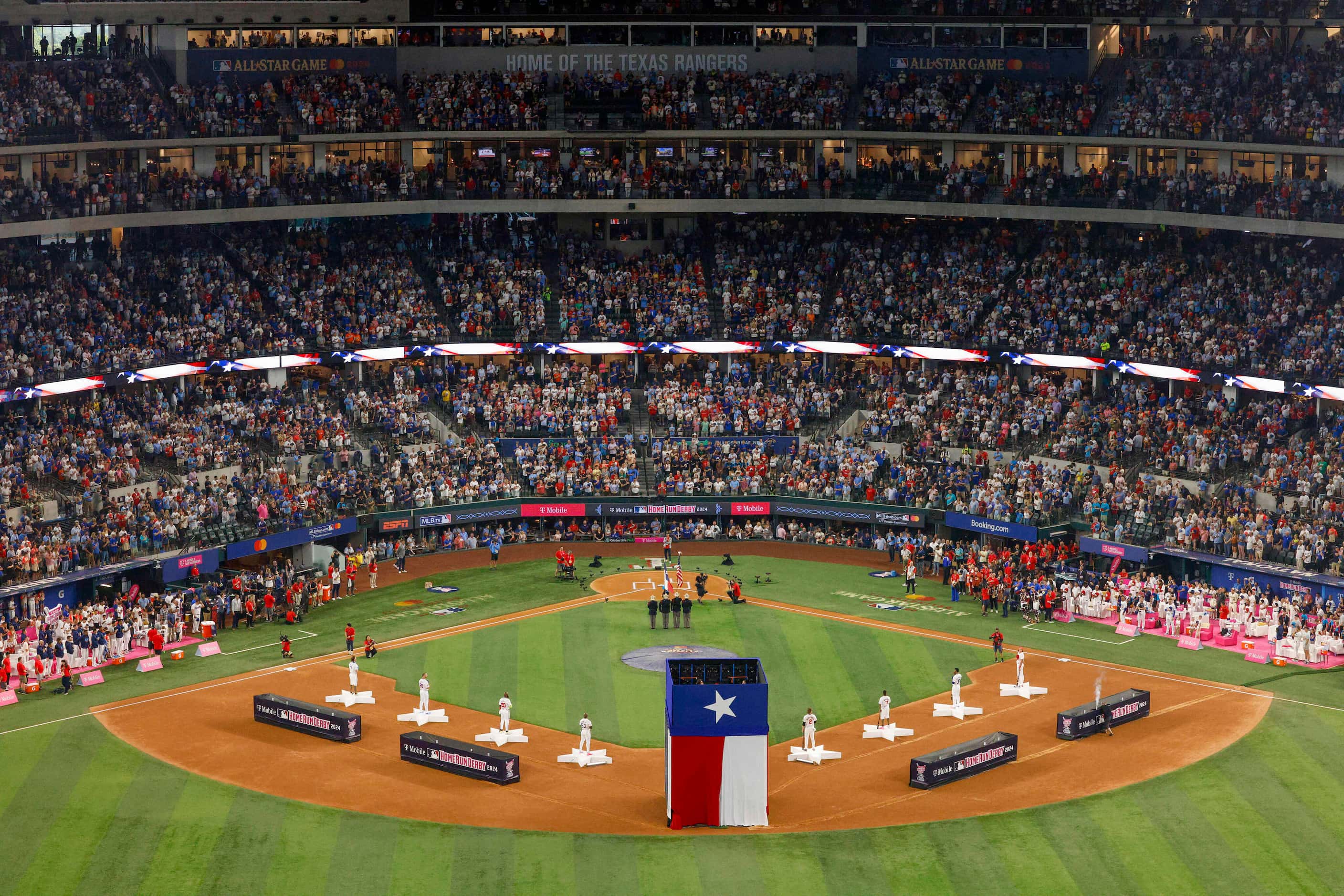 Players and fans stand for the national anthem before the MLB Home Run Derby, Monday, July...