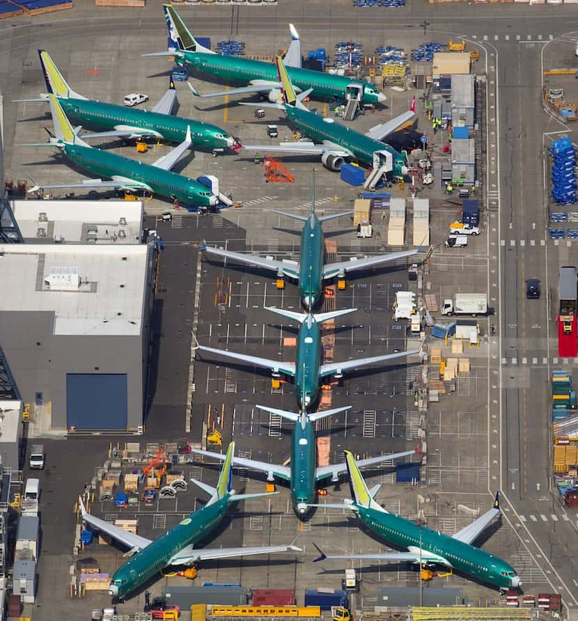 Boeing 737's, many of which are MAX 8 and 9's in various stages of completion, are parked...