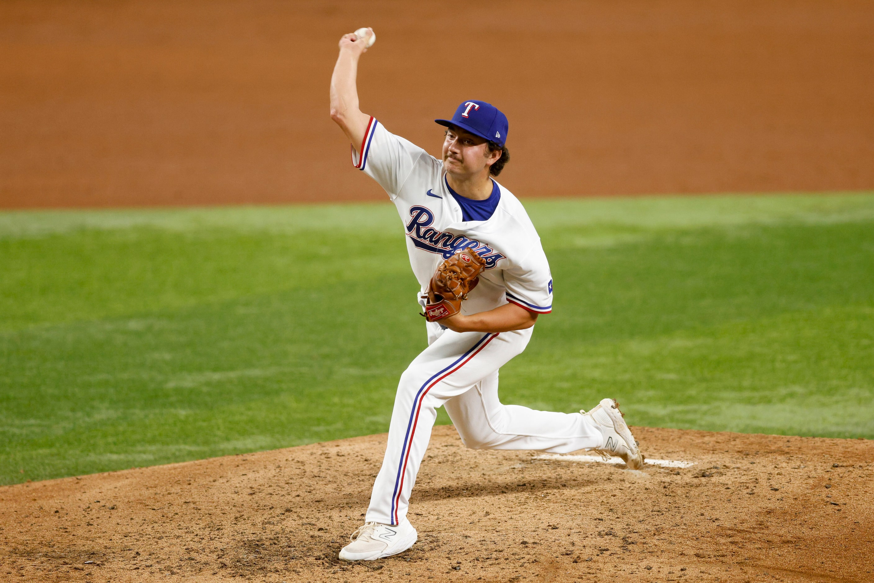 Texas Rangers relief pitcher Owen White (43) delivers a pitch during the sixth inning of a...