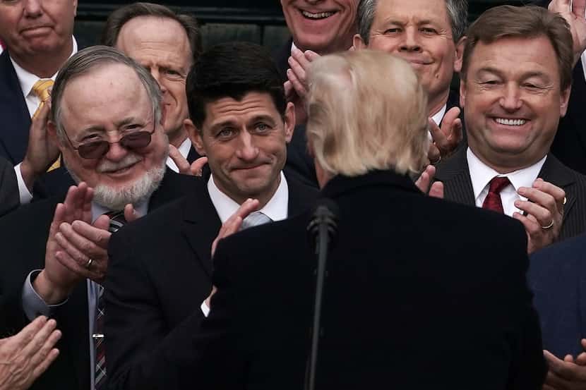 U.S. President Donald Trump greets Speaker of the House Paul Ryan during an event to...