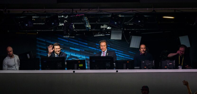 Broadcaster and former Dallas Cowboys quarterback Tony Romo, second from left, waves from...