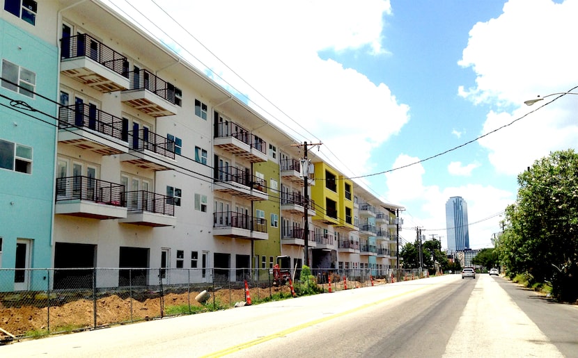 Developer Zad Roumaya's Digit 1919 apartments under construction on Akard Street at Cornith.