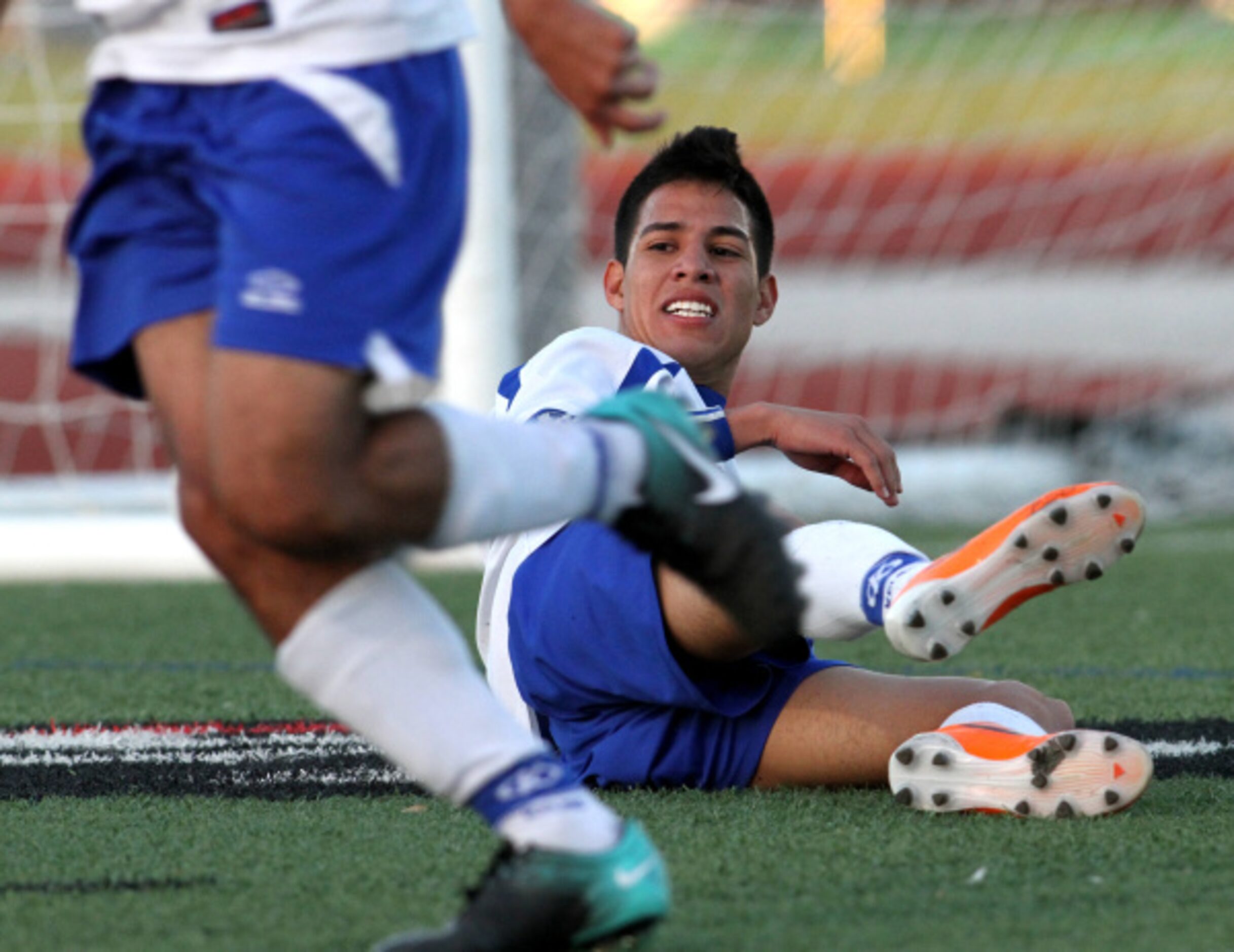 R.L. Turner's Isai Mireles (9) follows the action after losing his footing in front of his...