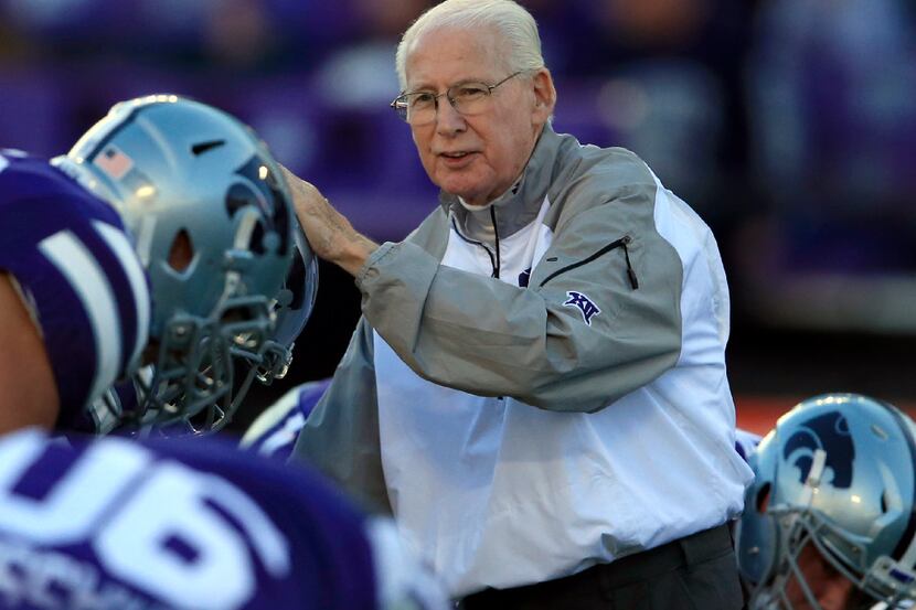 Kansas State head coach Bill Snyder greets players before an NCAA college football game...