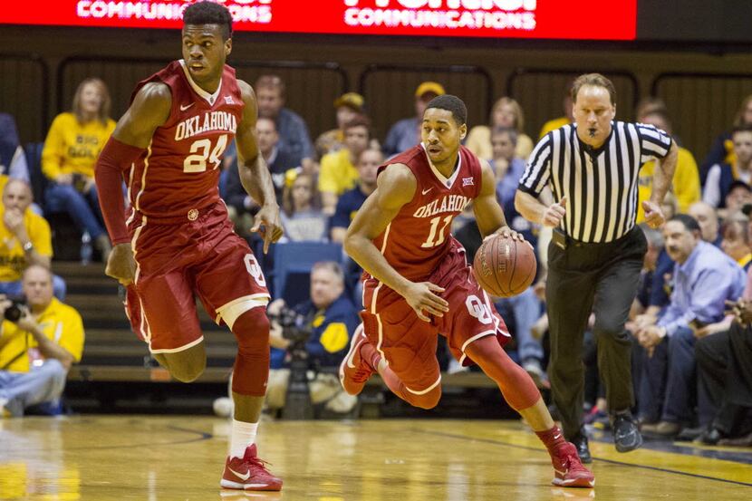 Oklahoma Sooners guard Isaiah Cousins (11) dribbles the ball during the first half against...