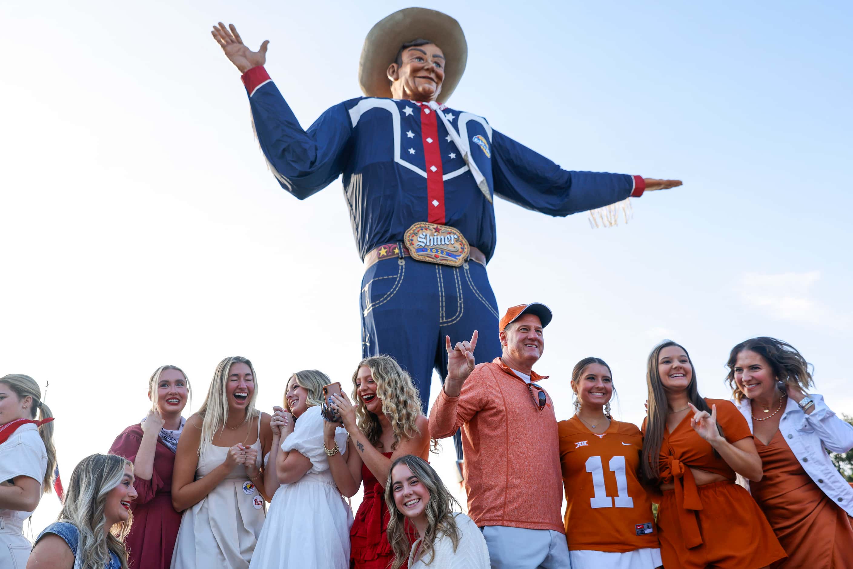 Fans gather ahead of the Red River Showdown by the Big Tex, on Saturday, Oct. 7, 2023, in...