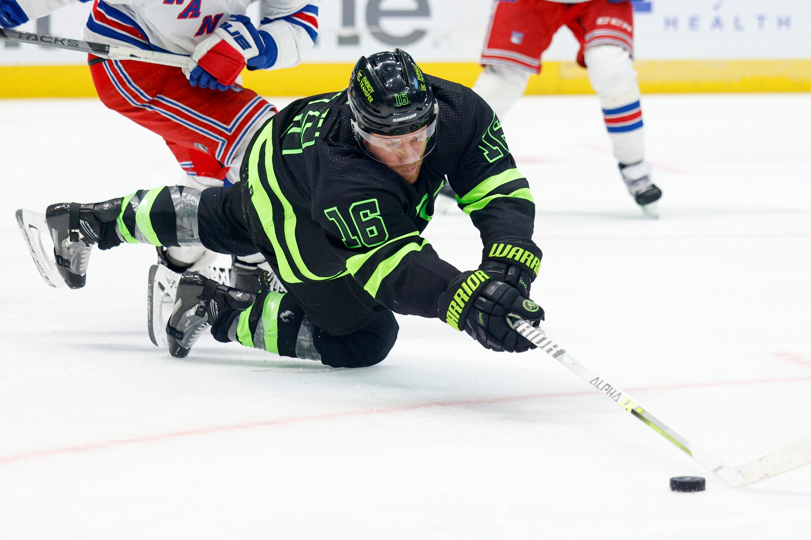 Dallas Stars center Joe Pavelski (16) dives to the ice to make a pass during the third...