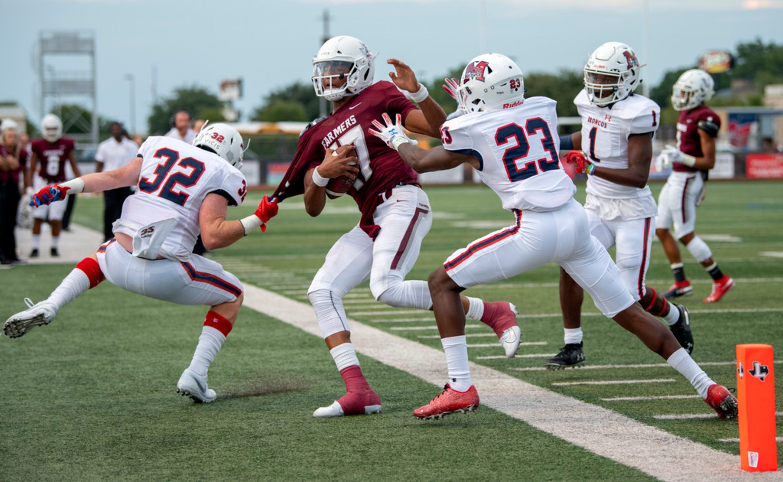 Lewisville junior quarterback Taylen Green (17) is pulled out of bounds near the goal line...