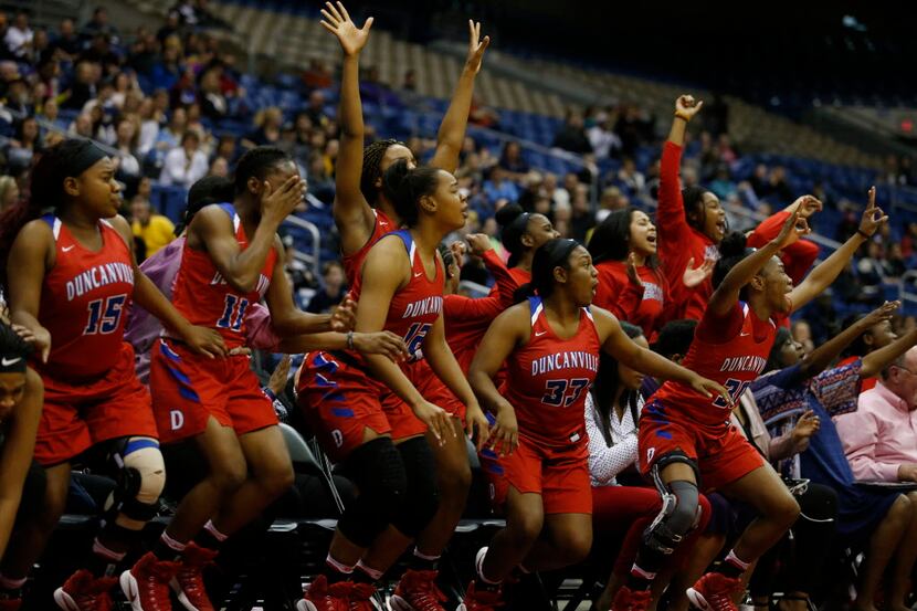 Duncanville bench celebrates as their teammates score against Houston Cypress Ranch during...