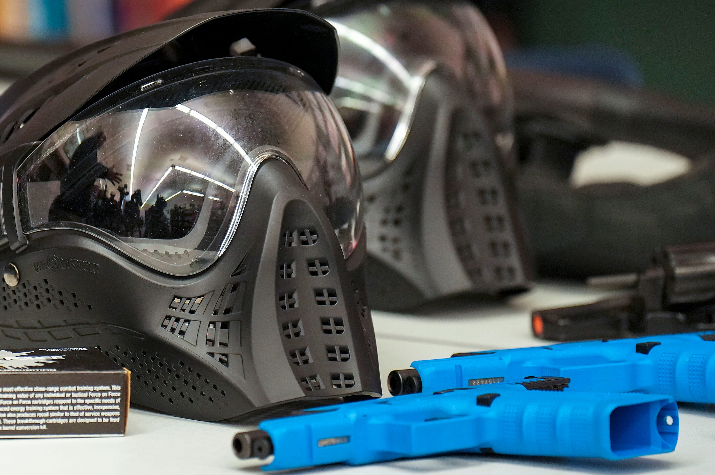 Cullen Grissom, TCOLE deputy chief, is reflected in the visor of a helmet next to a...