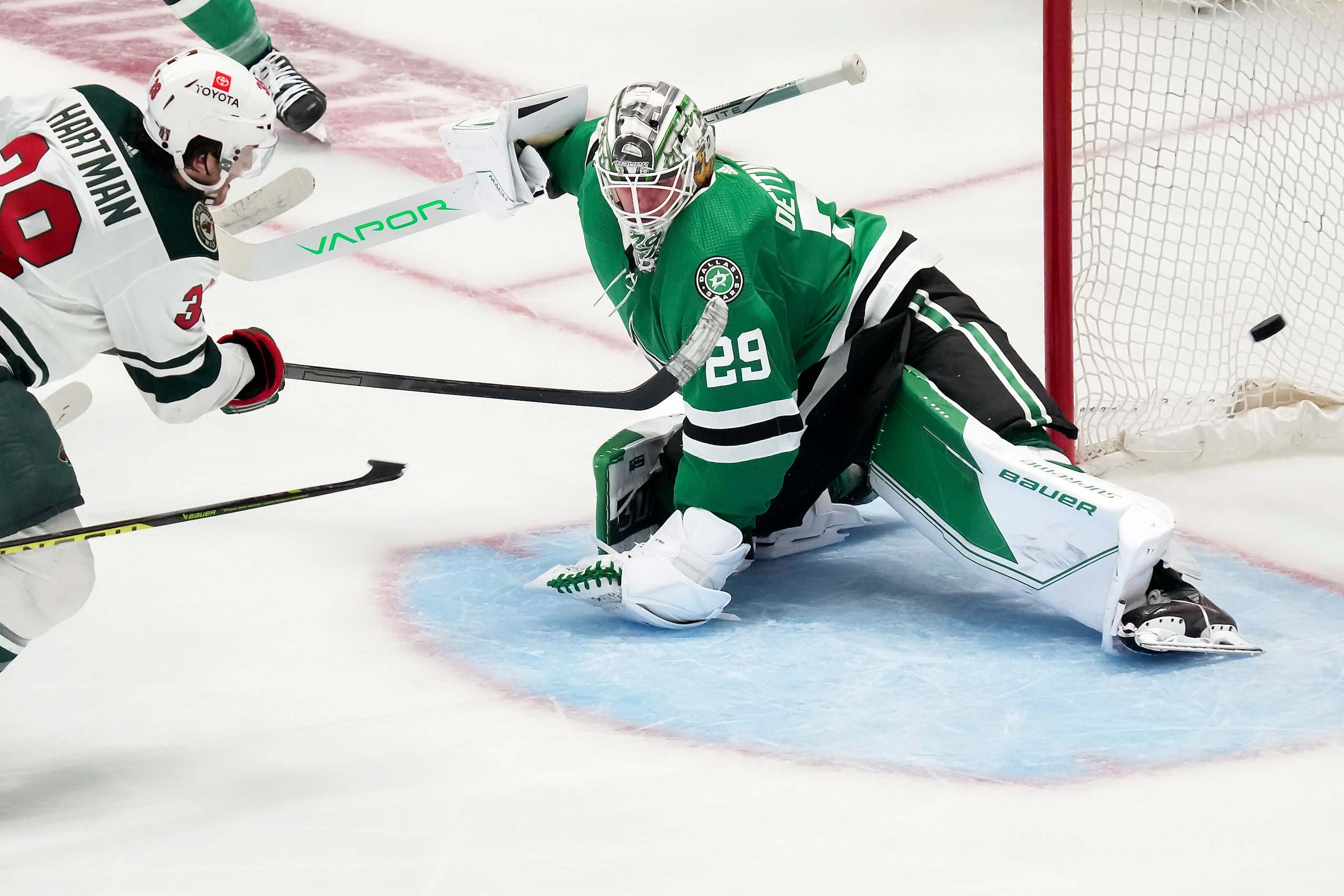 Minnesota Wild right wing Ryan Hartman (38) beats Dallas Stars goaltender Jake Oettinger...