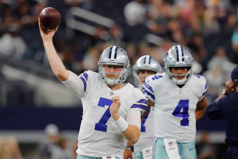 Dallas Cowboys quarterback Cooper Rush (7) passes in pregame warmups prior to a preseason...