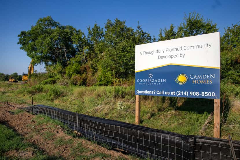 A sign at the site where Camden Homes, with a big assist from the private GrowSouth Fund, is...