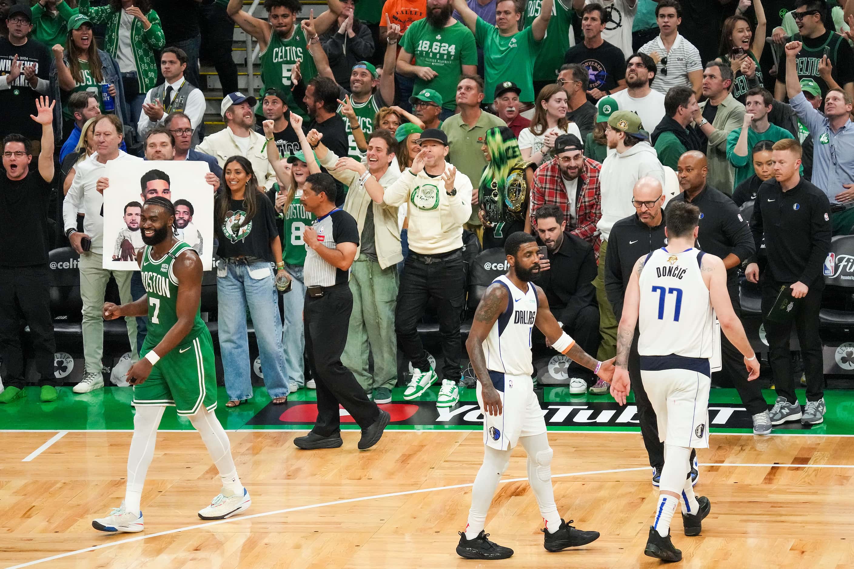 Boston Celtics guard Jaylen Brown (7) and Celtics fans celebrate as Dallas Mavericks guard...