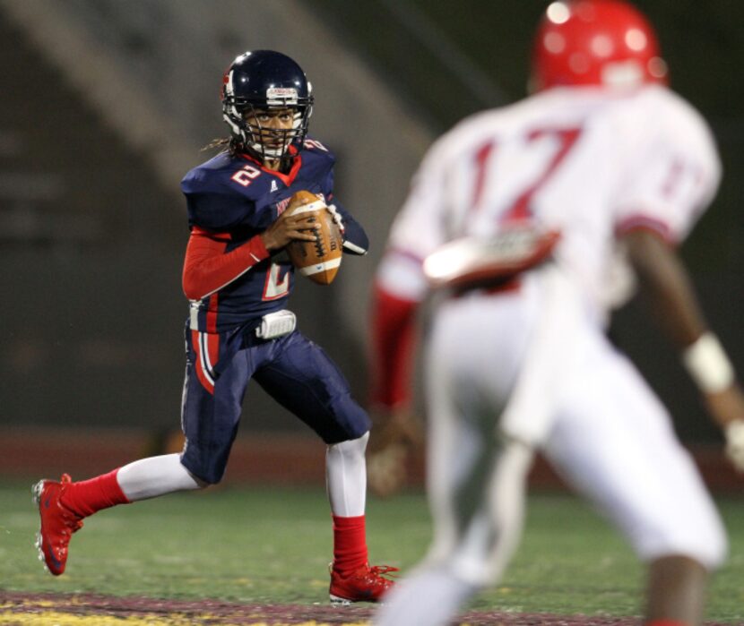 Kimball quarterback Traveon Thibeaux (2) eyes the Carter defense as he looks for an open...