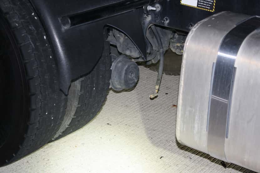 Photo of a disconnected brake line on the tractor trailer that was used as evidence in the...