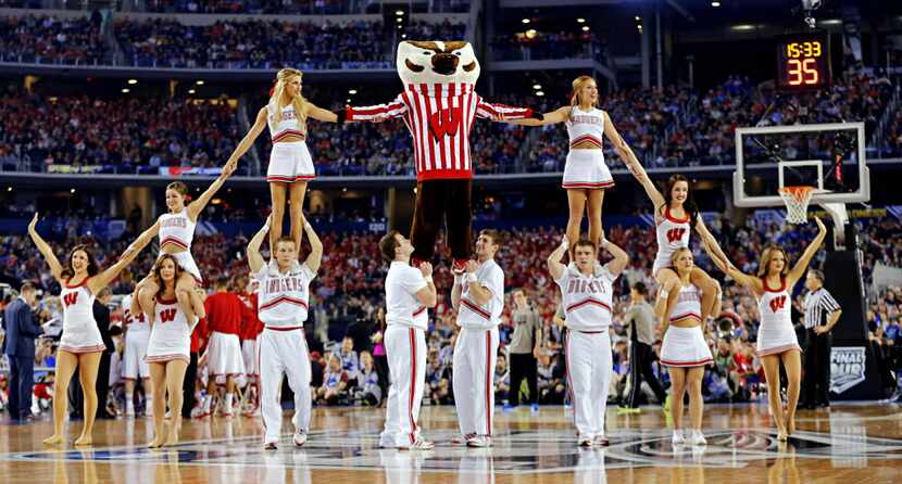 The Wisconsin Badgers cheer team perform during the second half of their NCAA Final Four...