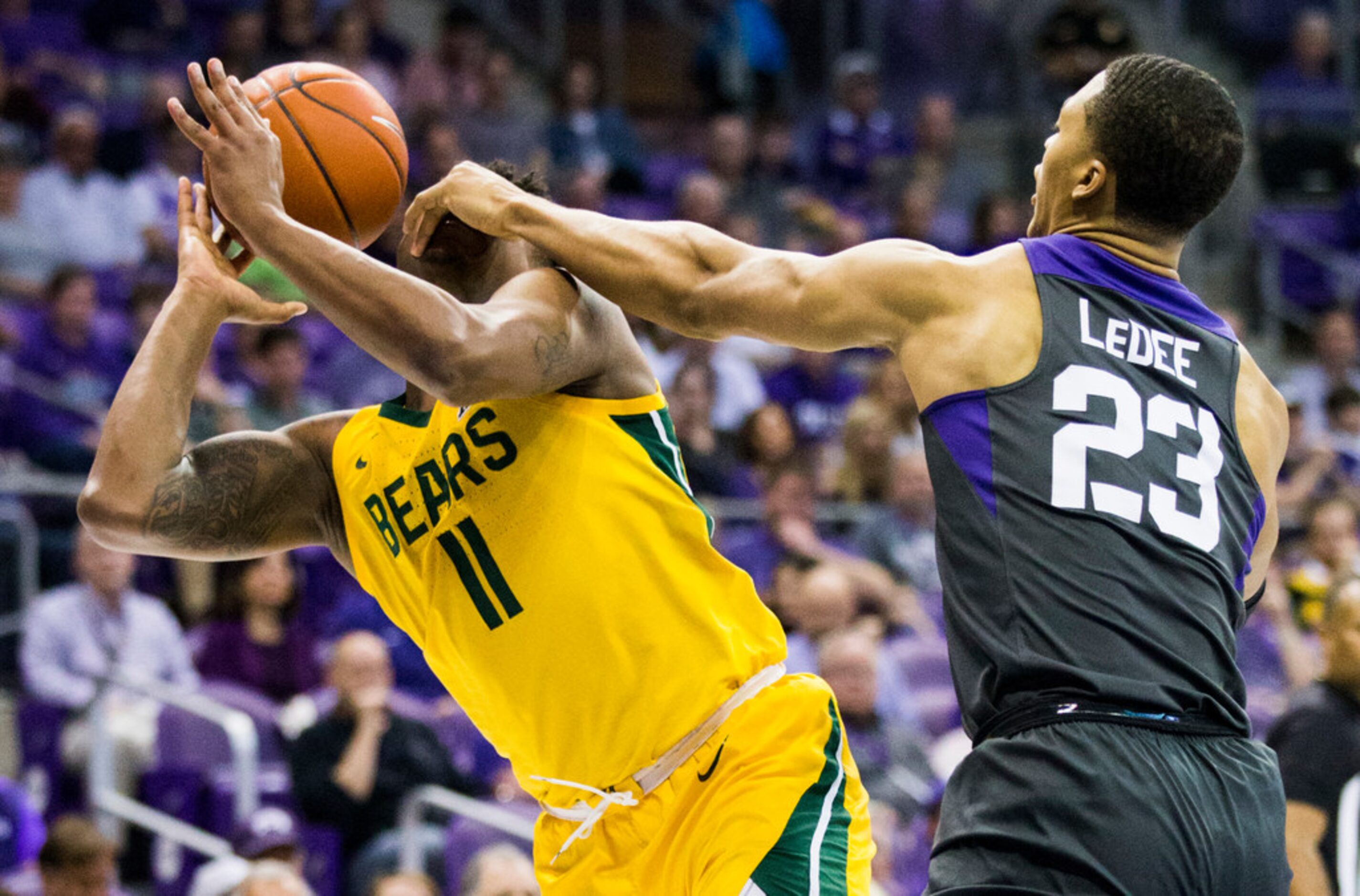 TCU Horned Frogs forward Jaedon LeDee (23) fouls Baylor Bears guard Mark Vital (11) during...