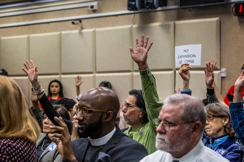 People raised their hands to speak as the Dallas Police Department presented recommendations...