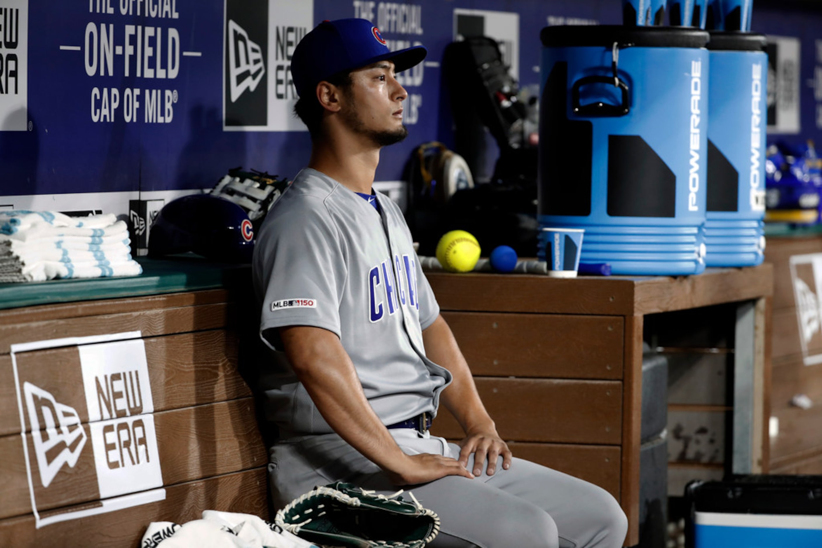 Chicago Cubs starting pitcher Yu Darvish (11) sits in the dugout after being pulled in the...