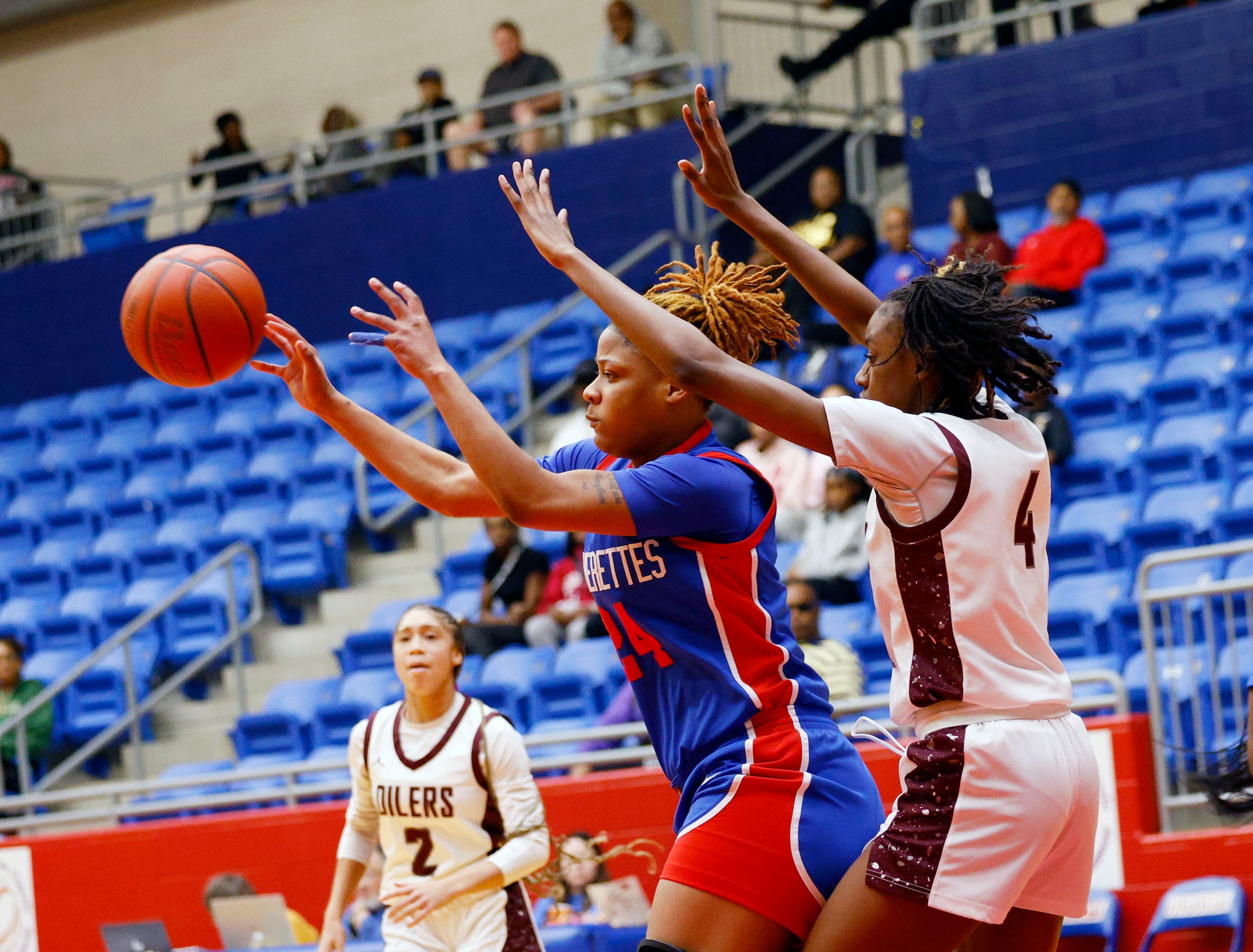 Duncanville's Kierston Russell (24) passes a ball as Pearland's Shiloh Grays (4) tries to...