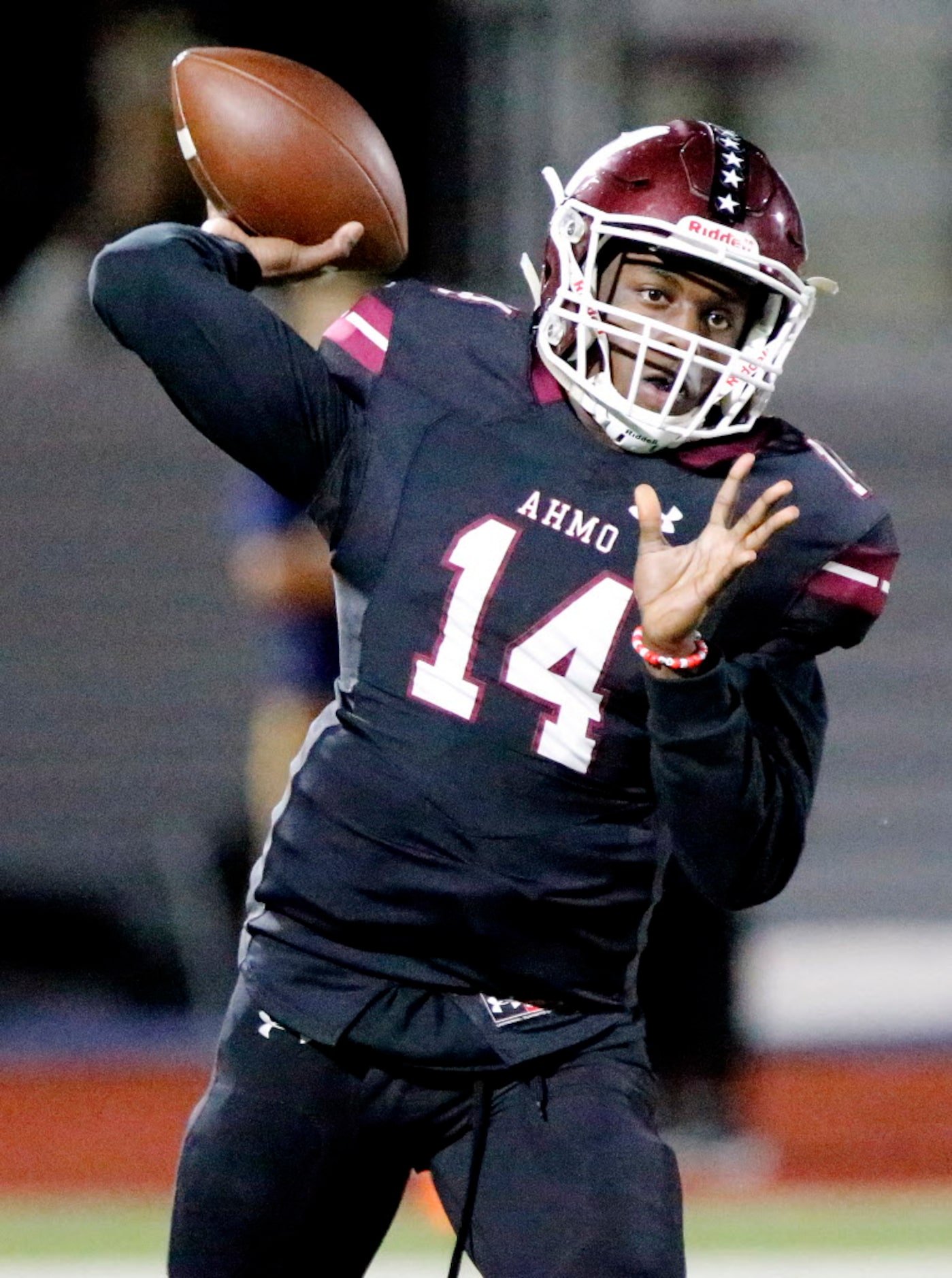 Wylie High School quarterback Rashad Dixon (14) throws a pass during the first half as Wylie...