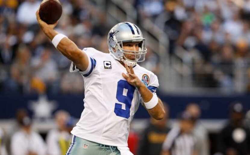 Dallas Cowboys quarterback Tony Romo (9) throws a pass down the field against the Pittsburgh...