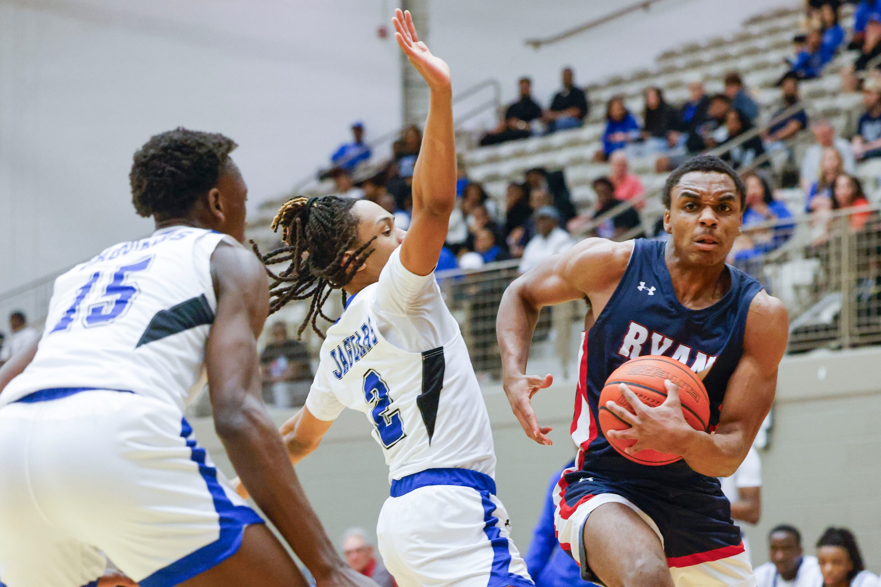 Mansfield Summit’s Ian Sedah (15), Cayden Brooks (2) attempt to defend against Denton Ryan’s...