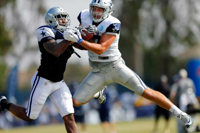 Dallas Cowboys rookie strong safety Kavon Frazier (35) strips the ball from tight end Geoff...