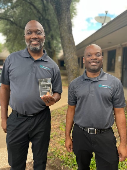 Harmony CDC Executive Director Mark Porter (left) and Senior Programs Director Isaac Burren...