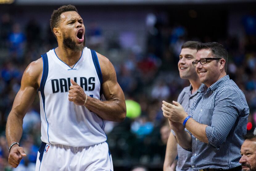 Dallas Mavericks guard Justin Anderson (1) celebrates a basket with fans during the third...