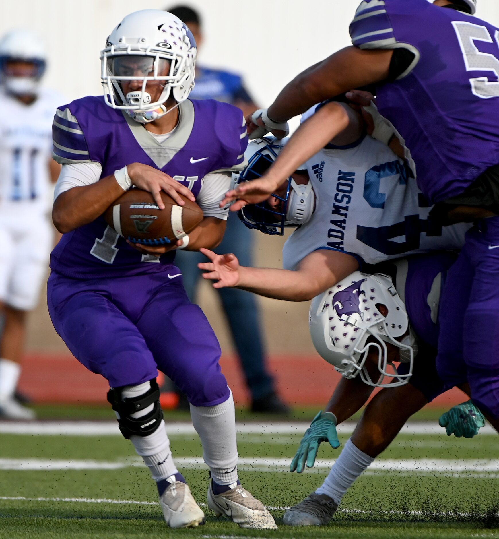 Sunset's Mateo Gomez (14) intercepts a pass intended for Adamson's Fabian Reyes (43) in the...