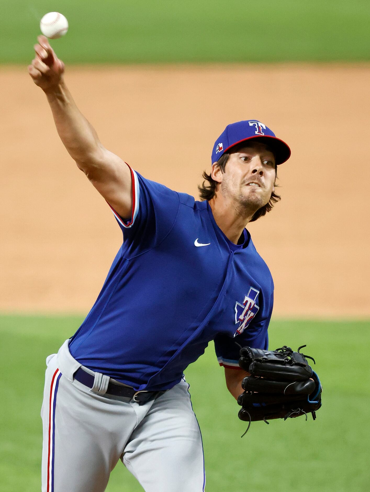 Texas Rangers Luke Farrell throws in relief during an intrasquad game at Summer Camp inside...