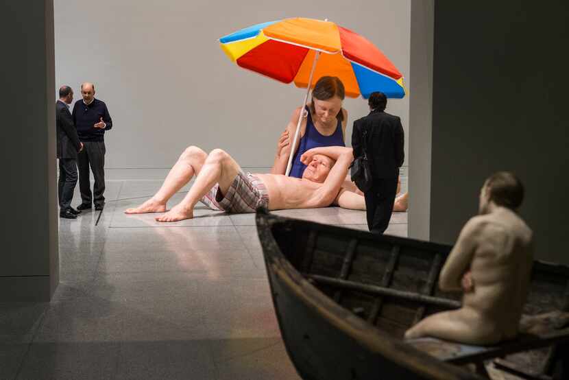Ron Mueck's couple Under An Umbrella and Man in Boat are shown during a preview of an...