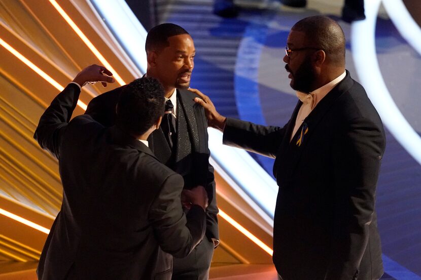 Sean Combs, from left, Will Smith and Tyler Perry appear in the audience at the Oscars in 2022.