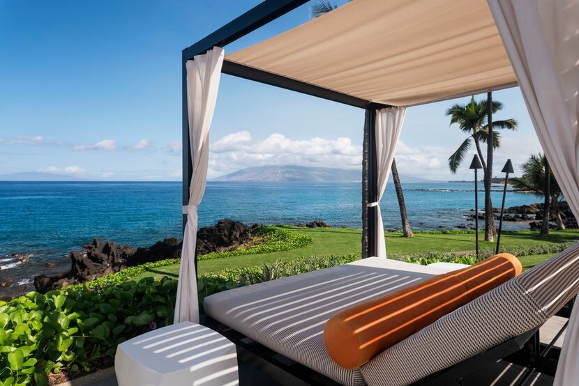 Enjoy the sounds of the crashing surf at an oceanfront cabana at Wailea Beach Resort.