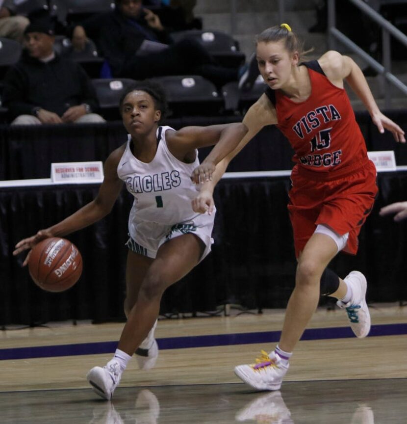 Prosper guard Maddison Willis-Rosa (1) drives around the defense of Vista Ridge guard AJ...