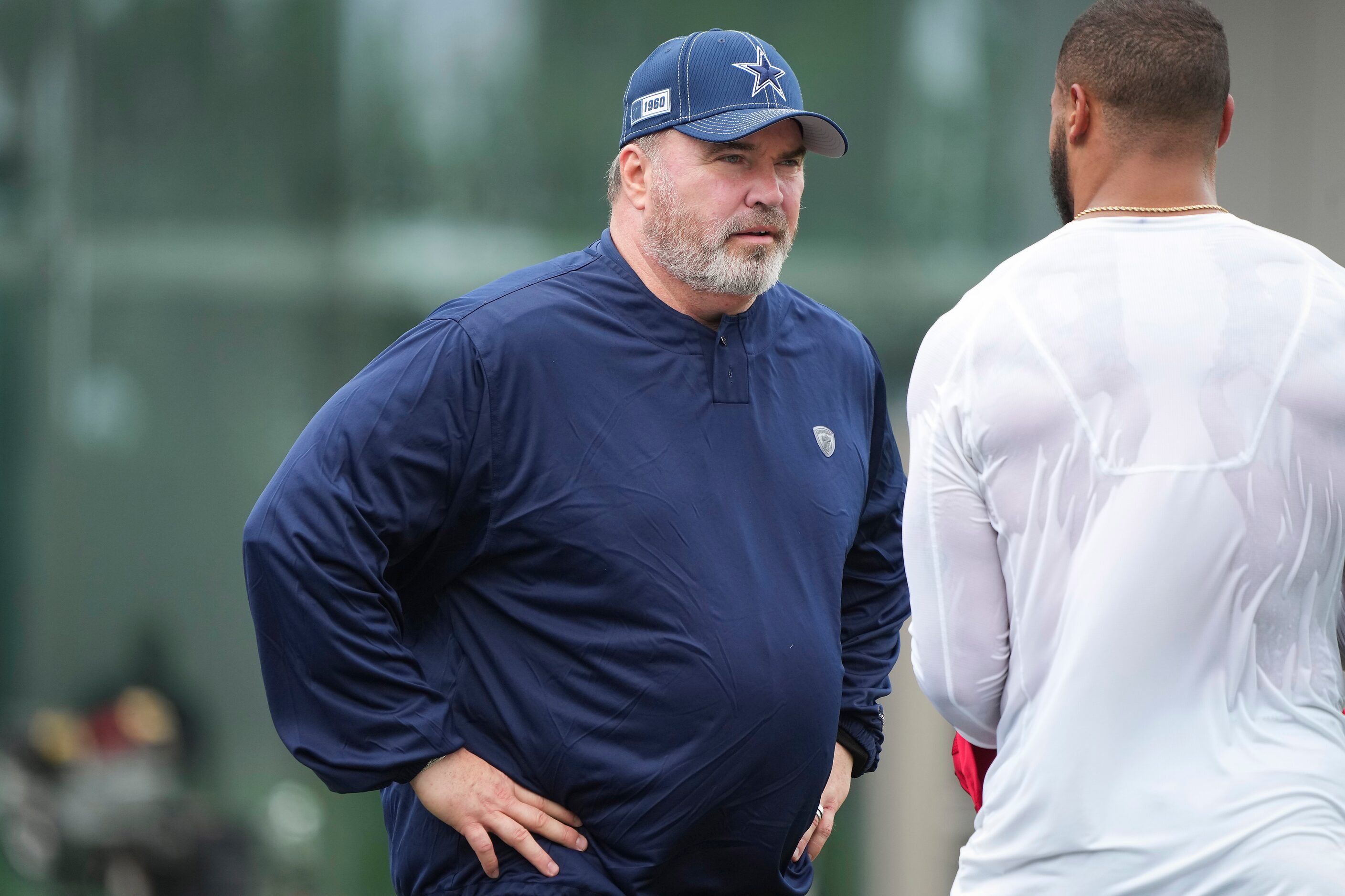 Dallas Cowboys head coach Mike McCarthy talks with quarterback Dak Prescott during a...