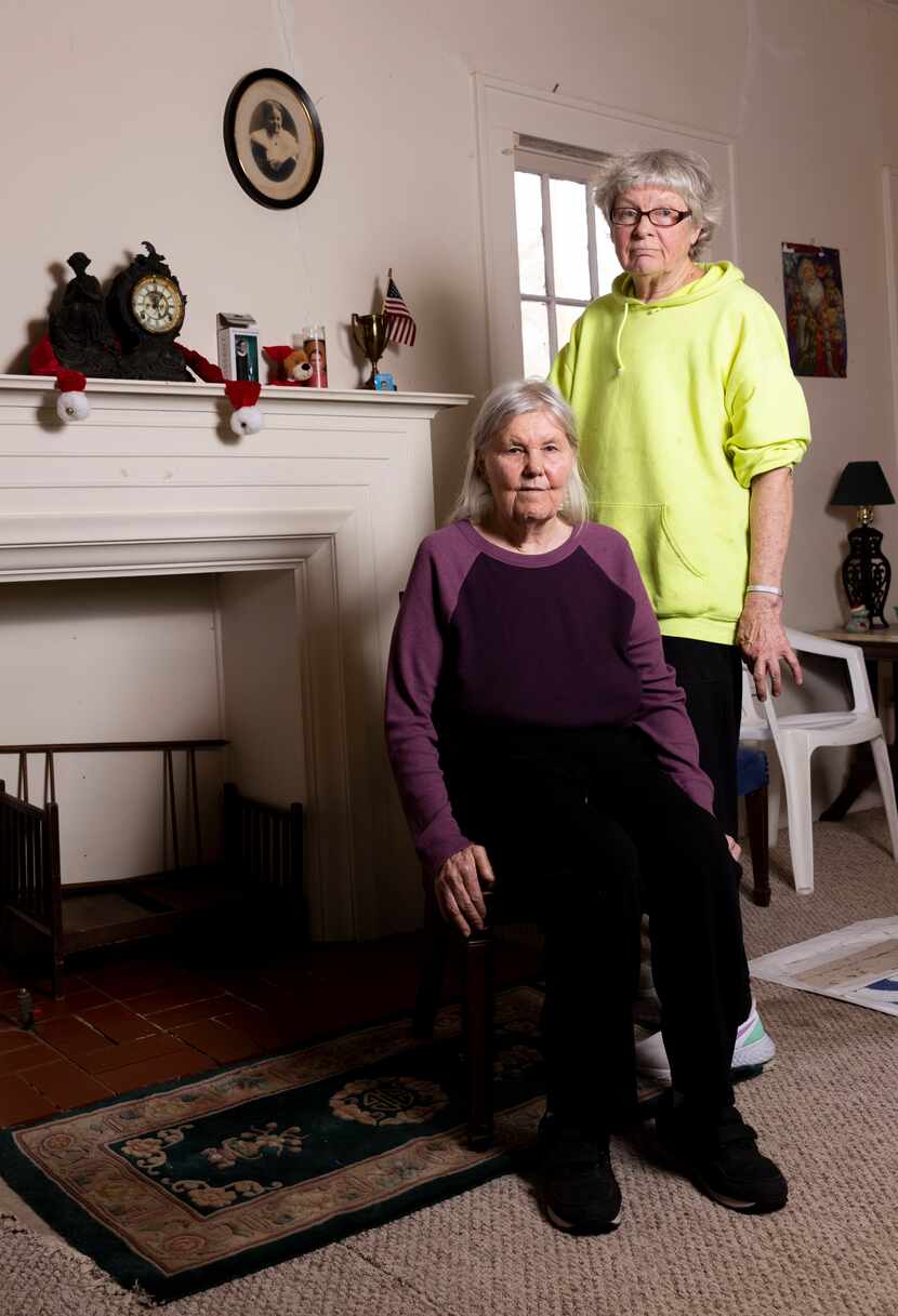 Linda Coffee (left) poses with partner Rebecca Hartt at their home on Thursday, Dec. 9,...